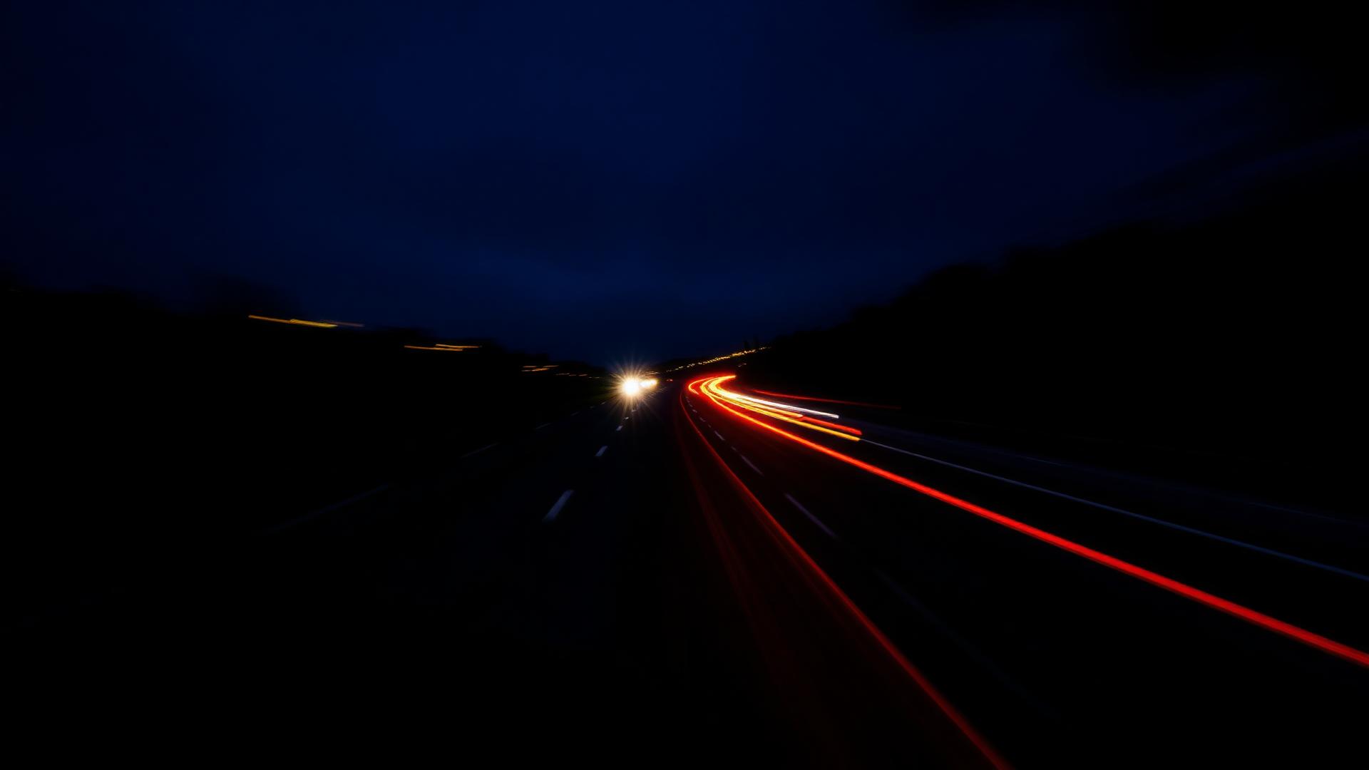 Long-exposure light trails on a night highway